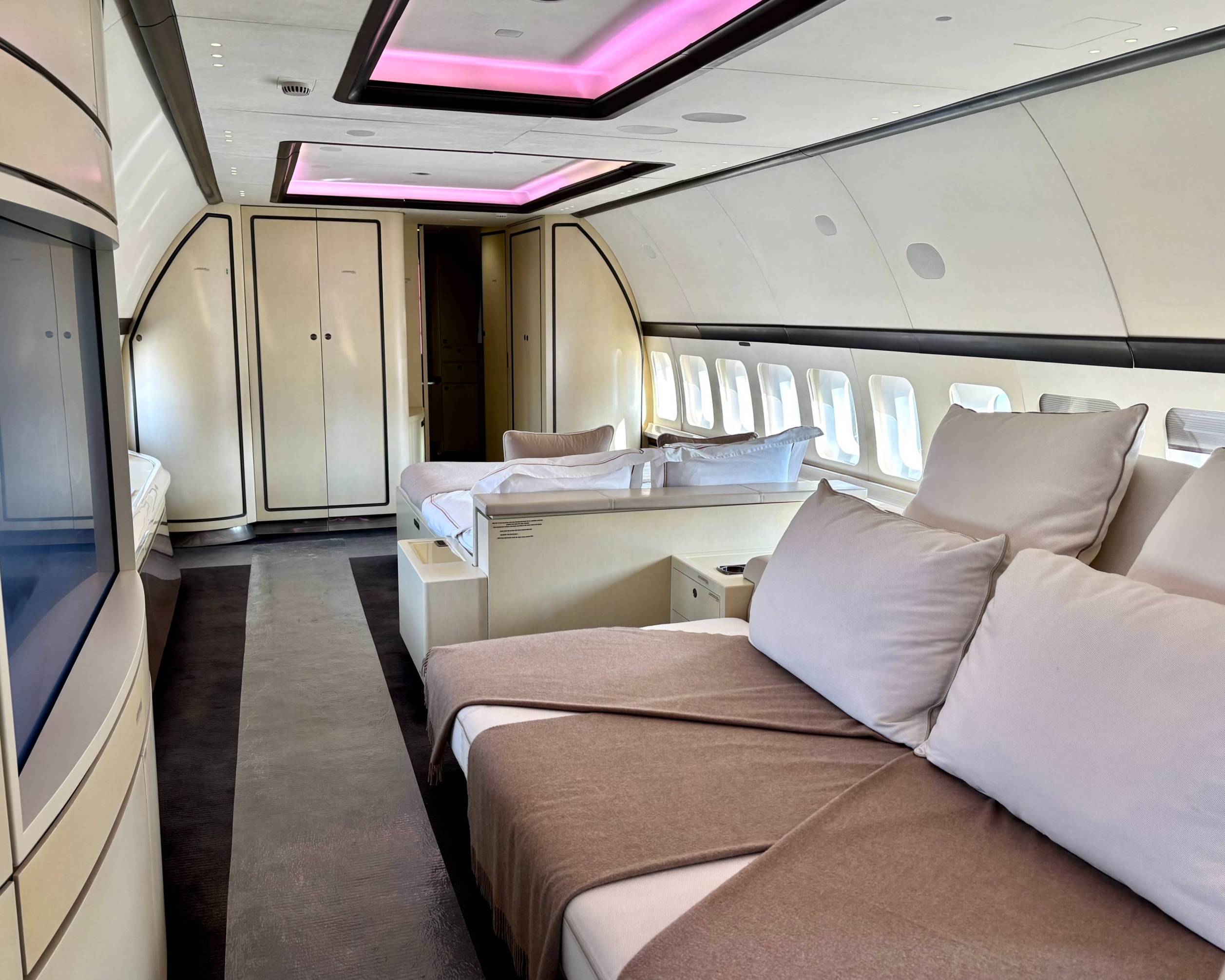 The master bedroom of this bbj has a large lounge & cinema area, followed by a double bed and bathroom with shower