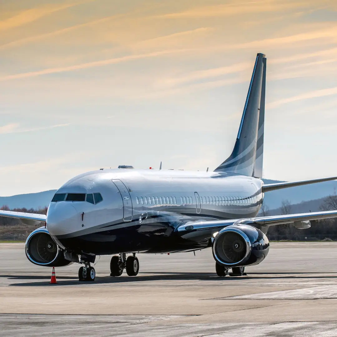 Private Boeing Business Jet on the runway with sunrise